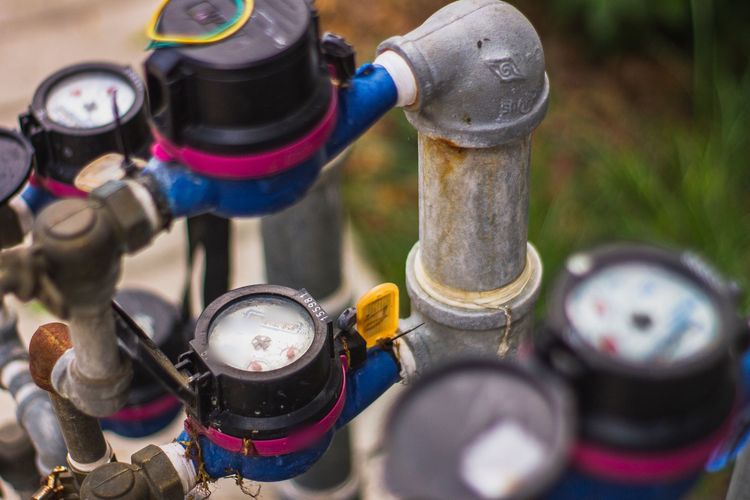 A row of water meters on a supply manifold